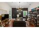 Bright office with large desk, hardwood floors, modern chandelier, and natural light at 3401 Stillhouse Se Rd, Atlanta, GA 30339