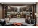 An elegant wine cellar with glass walls, custom shelving, and accent lighting for showcasing a vast collection at 3401 Stillhouse Se Rd, Atlanta, GA 30339