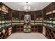 A stunning wine cellar featuring custom wood racking, ambient lighting, and climate control at 3401 Stillhouse Se Rd, Atlanta, GA 30339