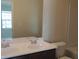 Bathroom features a double sink vanity with modern faucets, toilet, and large mirror at 515 Brady Dr, Villa Rica, GA 30180