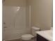 Clean bathroom featuring a shower and tub combo, toilet and modern vanity sink at 515 Brady Dr, Villa Rica, GA 30180