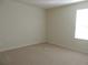 This is a carpeted room with neutral walls and trim with a window to provide natural light at 515 Brady Dr, Villa Rica, GA 30180