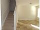 Bright room features a staircase and tile floors, leading to the upper level at 515 Brady Dr, Villa Rica, GA 30180