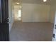 Inviting living room featuring neutral carpet, ample natural light, and smooth walls at 515 Brady Dr, Villa Rica, GA 30180
