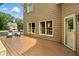 A back deck with wood floors, two blue chairs, and a sliding glass door at 5807 Brookstone Nw Walk, Acworth, GA 30101
