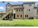 An exterior back of a house with two stories and a deck overlooking the backyard at 5807 Brookstone Nw Walk, Acworth, GA 30101