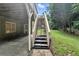View of the backyard from under the deck featuring stairs, patio, and grassy yard at 5807 Brookstone Nw Walk, Acworth, GA 30101