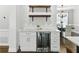 Wet bar with mini-fridge and wine rack and white marble countertop at 5807 Brookstone Nw Walk, Acworth, GA 30101