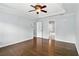 Primary bedroom boasts hardwood floors, neutral walls, white trim, and a ceiling fan at 5807 Brookstone Nw Walk, Acworth, GA 30101