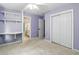 Bedroom features carpet, custom closets, and neutral paint at 5807 Brookstone Nw Walk, Acworth, GA 30101