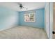 Bright bedroom with a ceiling fan, a window with blinds, and neutral carpet at 5807 Brookstone Nw Walk, Acworth, GA 30101