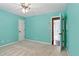 Bedroom features light blue walls, neutral carpet, and a ceiling fan at 5807 Brookstone Nw Walk, Acworth, GA 30101