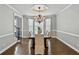 Formal dining room with chandelier, hardwood floors, and large windows at 5807 Brookstone Nw Walk, Acworth, GA 30101