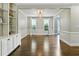 Elegant dining room with hardwood floors, built-in cabinets, and natural light at 5807 Brookstone Nw Walk, Acworth, GA 30101