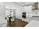 Open concept dining room with adjacent kitchen and stainless steel appliances at 5807 Brookstone Nw Walk, Acworth, GA 30101