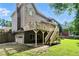 Exterior of home with deck and stairs overlooking a spacious backyard and garage at 5807 Brookstone Nw Walk, Acworth, GA 30101