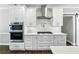 Contemporary kitchen features stainless steel appliances and white marble countertops at 5807 Brookstone Nw Walk, Acworth, GA 30101