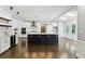 Modern kitchen featuring a large island with seating and stainless steel appliances at 5807 Brookstone Nw Walk, Acworth, GA 30101