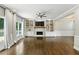 Bright living room with fireplace, built-in shelving, and hardwood floors at 5807 Brookstone Nw Walk, Acworth, GA 30101