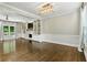 Bright living room featuring built-in shelving, a fireplace, and hardwood floors at 5807 Brookstone Nw Walk, Acworth, GA 30101