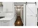 Hallway featuring a pantry sliding door and modern countertops at 5807 Brookstone Nw Walk, Acworth, GA 30101
