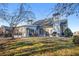 Enjoy this home's expansive backyard and patio with ample seating and mature trees at 845 Melbourne Trl, Alpharetta, GA 30009