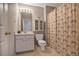 Bright bathroom featuring a vanity with storage and a shower with a patterned curtain at 845 Melbourne Trl, Alpharetta, GA 30009