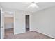 Neutral bedroom offers plush carpet, a closet, and access to other areas at 845 Melbourne Trl, Alpharetta, GA 30009