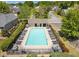 Aerial view of the pool area surrounded by plenty of lounge chairs for relaxing at 845 Melbourne Trl, Alpharetta, GA 30009