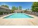 Community pool surrounded by lounge chairs and greenery, perfect for relaxation at 845 Melbourne Trl, Alpharetta, GA 30009