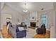 Living room featuring fireplace, hardwood floors, neutral walls, and recessed lighting at 845 Melbourne Trl, Alpharetta, GA 30009