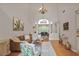 Bright living room featuring high ceilings, chandelier, wood floors, and open to the dining room at 845 Melbourne Trl, Alpharetta, GA 30009