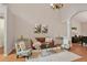 Inviting living room with high ceilings, hardwood floors, and neutral paint at 845 Melbourne Trl, Alpharetta, GA 30009