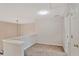Cozy loft space with neutral carpet, walls, and a light fixture at 845 Melbourne Trl, Alpharetta, GA 30009