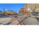 A commercial district with brick buildings, shops, and street parking under a clear blue sky at 845 Melbourne Trl, Alpharetta, GA 30009