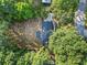 Aerial view of home surrounded by mature trees on a lush, green property at 2135 Huntington Dr, Loganville, GA 30052