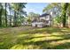 Large backyard with expansive grass, perfect for outdoor activities and gatherings at 2135 Huntington Dr, Loganville, GA 30052