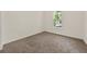 Bedroom with neutral carpet and window at 2135 Huntington Dr, Loganville, GA 30052