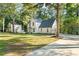 Charming updated farmhouse with mature trees and a long driveway at 2135 Huntington Dr, Loganville, GA 30052
