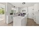 Modern kitchen with white cabinets, stainless steel appliances, and a functional center island at 2135 Huntington Dr, Loganville, GA 30052