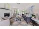 Bright living room featuring a decorative fireplace, modern furniture, and artistic accents at 2135 Huntington Dr, Loganville, GA 30052