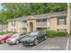 Apartment building with balconies and parking featuring well-maintained landscaping at 3135 Seven Pines Ct # 8, Atlanta, GA 30339