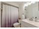 Well-maintained bathroom with a modern vanity, updated fixtures, and a shower/tub combination with a textured curtain at 3135 Seven Pines Ct # 8, Atlanta, GA 30339