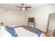 Comfortable bedroom features wood floors, ceiling fan, closet, and well-lit with natural light from the window at 3135 Seven Pines Ct # 8, Atlanta, GA 30339
