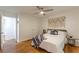 Bright bedroom with ceiling fan, wooden floors, neutral walls, and tastefully decorated with natural textures at 3135 Seven Pines Ct # 8, Atlanta, GA 30339