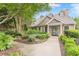 Close up of community clubhouse with attractive landscaping, stone accents, and a welcoming entrance at 3135 Seven Pines Ct # 8, Atlanta, GA 30339