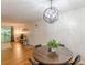 Dining room with hardwood floors and a modern light fixture, open to the living area at 3135 Seven Pines Ct # 8, Atlanta, GA 30339
