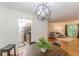 Dining area with a modern light fixture and open layout to a living room and kitchen at 3135 Seven Pines Ct # 8, Atlanta, GA 30339
