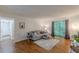 Bright living room with hardwood floors, neutral colors, and a sliding glass door to the outside at 3135 Seven Pines Ct # 8, Atlanta, GA 30339