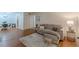Cozy living room with a gray sofa, hardwood floors, and natural light near an eat-in kitchen at 3135 Seven Pines Ct # 8, Atlanta, GA 30339